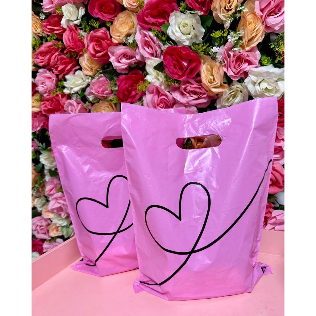 Sacolas Plasticas Para Loja Tamanho 30×40, boca de palhaço/alça vazada na cor ROSA  Kit com 50 unid