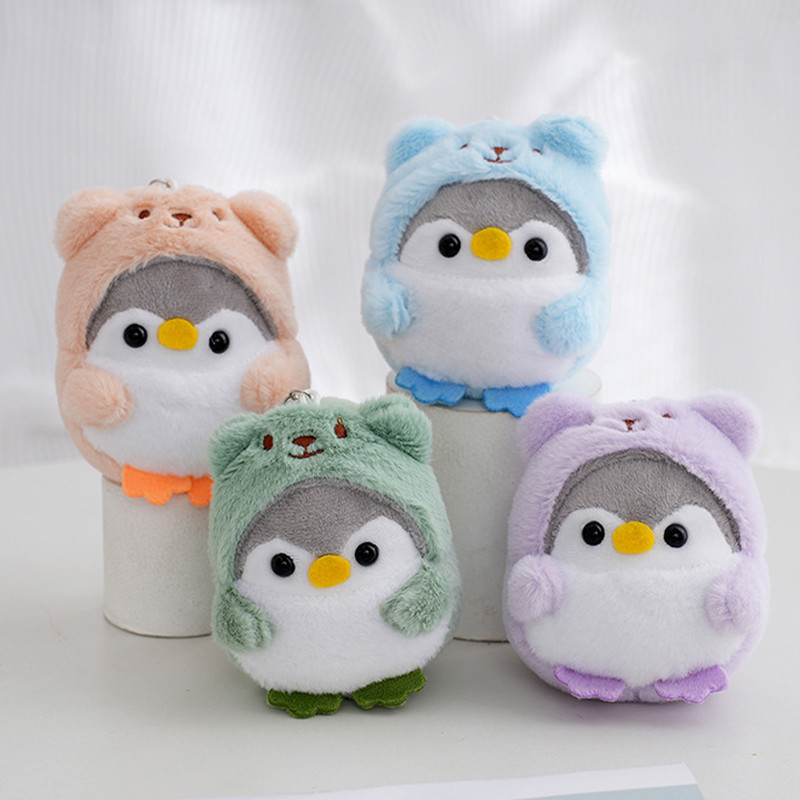Transformação pinguim brinquedo de pelúcia saco
