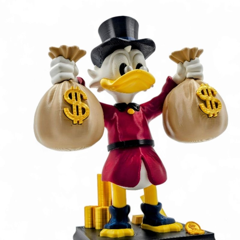 Tio Patinhas Segurando Sacos de Dinheiro 20cm Acti